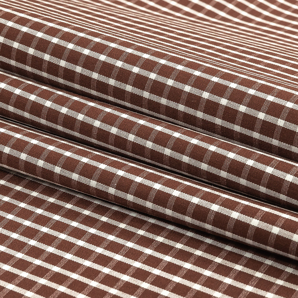 Brown and White Checkered Cotton and Polyester Shirting Folded Brown and White Checkered Cotton and Polyester Shirting Folded