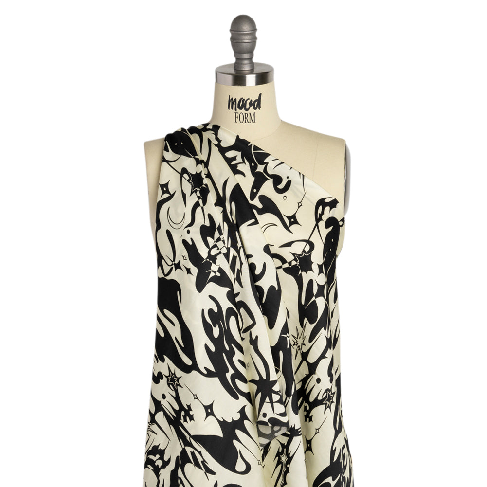 Sustainable and Recycled Viscose Satin Print - Cream and Black Abstract and Stars - Mood Exclusive Cosmic Chaos Detail Sustainable and Recycled Viscose Satin Print - Cream and Black Abstract and Stars - Mood Exclusive Cosmic Chaos Detail