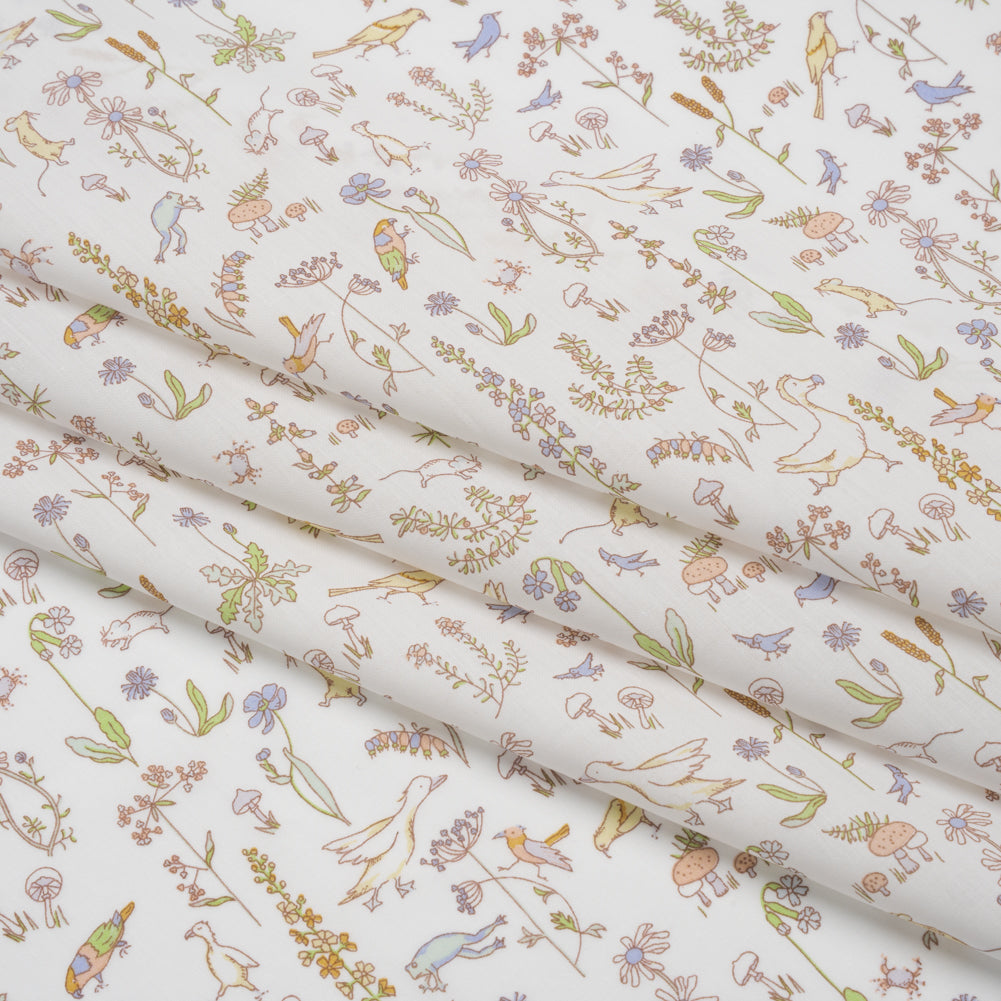 Liberty Fabrics Tana Lawn® - Theo Yellow - Pale Yellow, Spring Green and Blue Cartoon Creatures and Flowers - Folded Liberty Fabrics Tana Lawn® - Theo Yellow - Pale Yellow, Spring Green and Blue Cartoon Creatures and Flowers - Folded