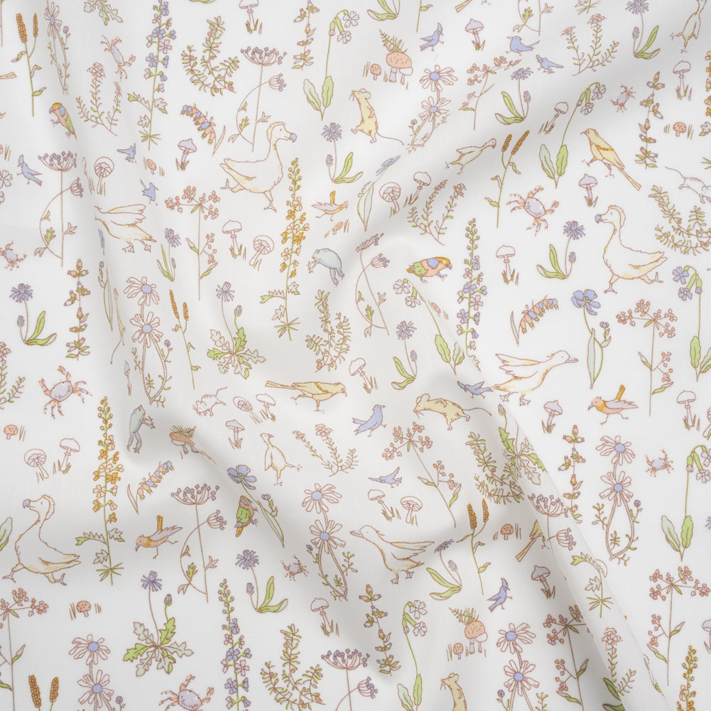 Liberty Fabrics Tana Lawn® - Theo Yellow - Pale Yellow, Spring Green and Blue Cartoon Creatures and Flowers Liberty Fabrics Tana Lawn® - Theo Yellow - Pale Yellow, Spring Green and Blue Cartoon Creatures and Flowers