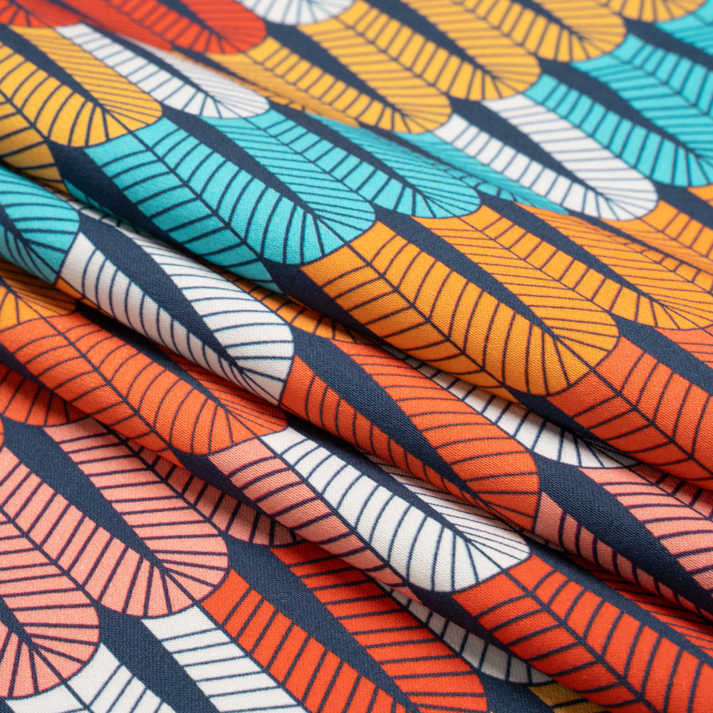 Stretch Cotton Sateen - Orange and Blue Geometric Feathers - Mood Exclusive Flock Together Print - Folded Stretch Cotton Sateen - Orange and Blue Geometric Feathers - Mood Exclusive Flock Together Print - Folded