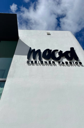 Sign on a building with a blue sky in the background