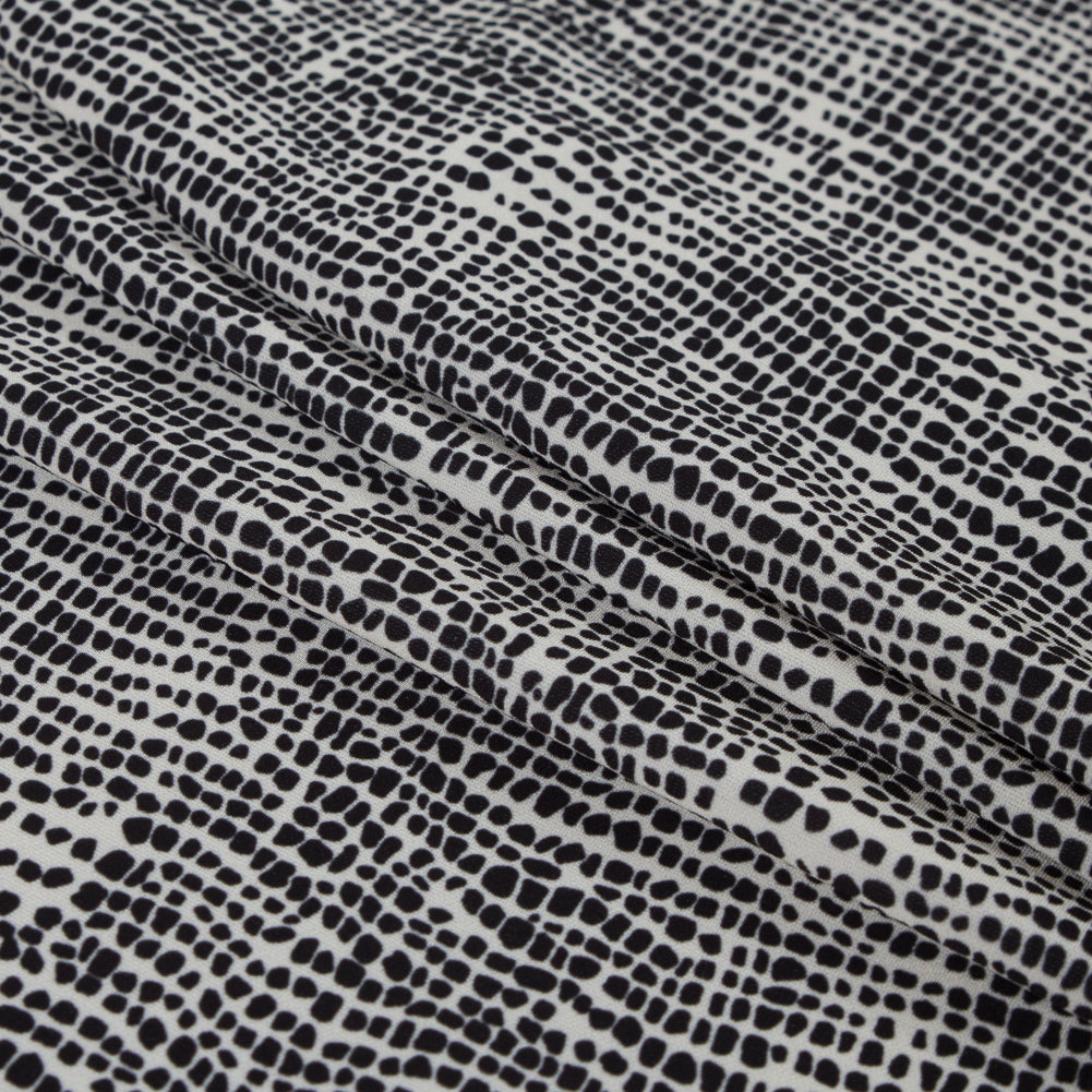 Italian Ivory Reptilian Digitally Printed Stretch Polyester Folded