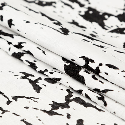 White and Black Abstract Burnout Polyester Woven with Fused Backing Folded