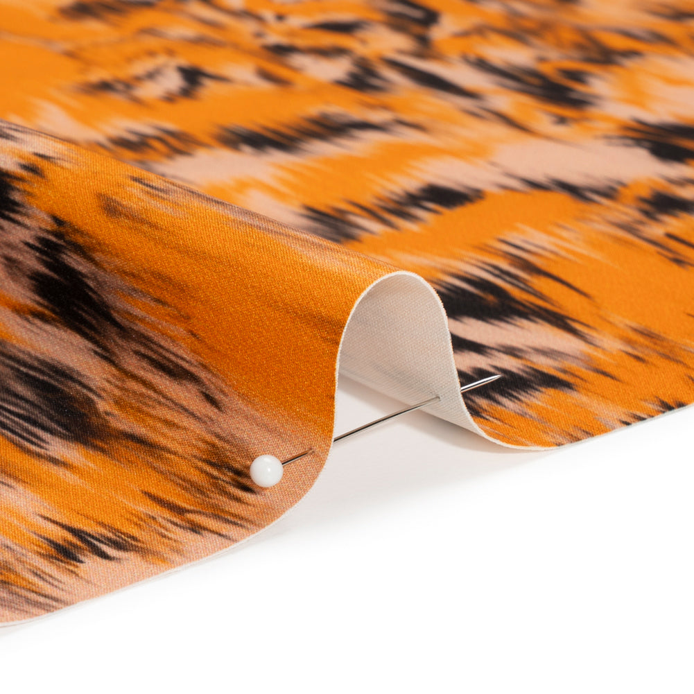 Stretch Polyester Woven Print - Orange and Black Abstract Ikat - Mood Exclusive Shifting Sands Detail