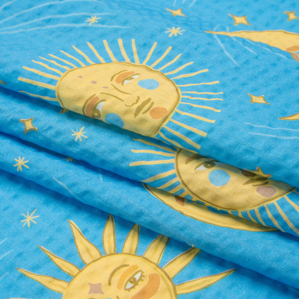 Cotton and Viscose Striped Seersucker Print - Sky Blue Suns and Moons - Mood Exclusive Friendly Faces Folded