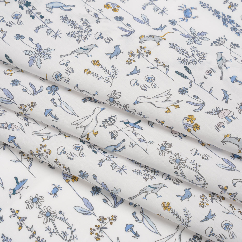 Liberty Fabrics Tana Lawn® - Theo Blue - Baby Blue, Yellow and White Cartoon Creatures and Flowers - Folded