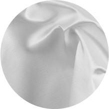 A white fabric is folded in a circle on a white background