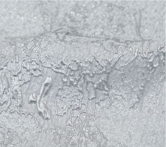 A close up of a frosty surface with a lot of water on it