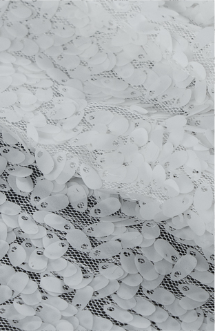 A white lace with a flower pattern on it