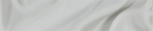 A close up of a white cloth with a black and white cat