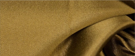 A close up of a tie and a suit on a table