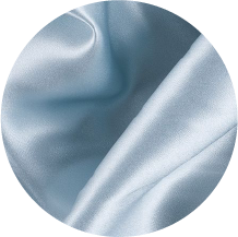 A close up of a blue fabric with a circular shape