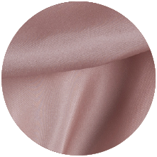 A close up of a pink fabric with a circular shape