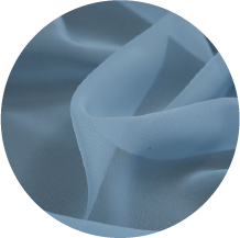 A close up of a blue fabric with a circular shape