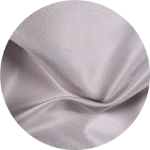 A close up of a white fabric with a circular pattern