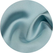 A close up of a blue fabric with a circular shape