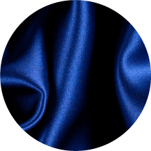 A close up of a blue silk fabric with a black background
