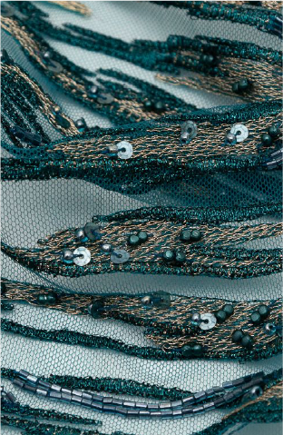 A close up of a bunch of green and black beads