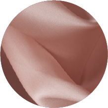 A close up of a pink fabric with a circular shape