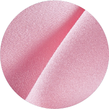 A close up of a pink fabric with a circular shape