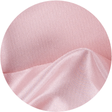 A close up of a pink fabric with a circular shape