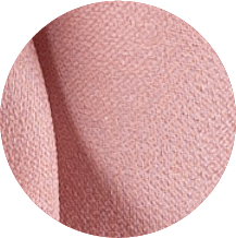 A close up of a pink fabric with a circular shape