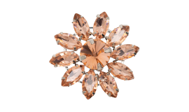 A close up of a brooch with a flower design on it
