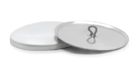 Two white plates with a silver lid on a white surface