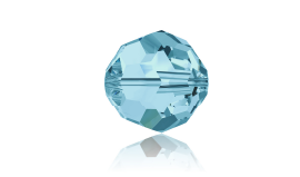 A close up of a faceted blue crystal bead