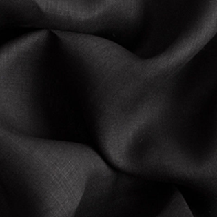 A close up of a black fabric with a white background