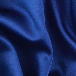 A close up of a blue fabric with a white background
