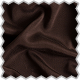 A close up of a brown fabric with a scallop edge