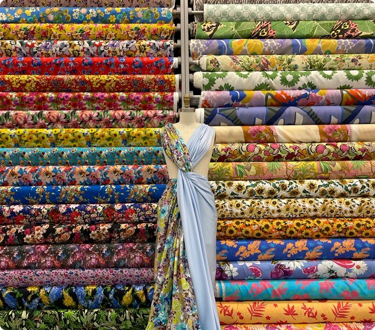 A close up of a display of colorful fabrics and fabrics