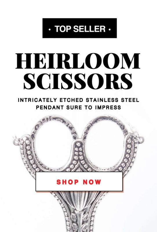 A close up of a pair of scissors with a sign on it