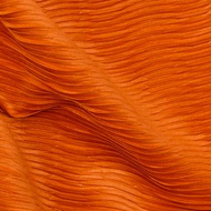 An orange fabric with a wavy pattern is shown
