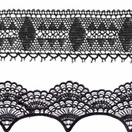 A close up of a pair of black laces on a white background