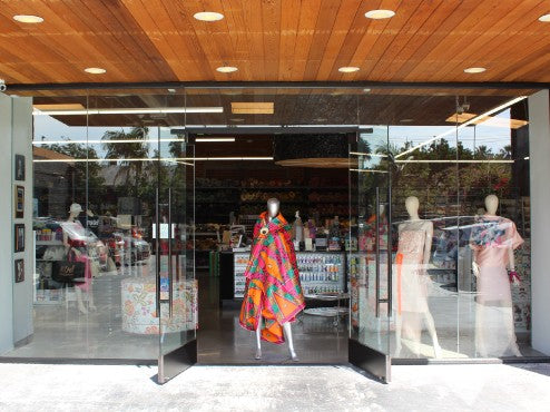 A close up of a store front with a display of clothing