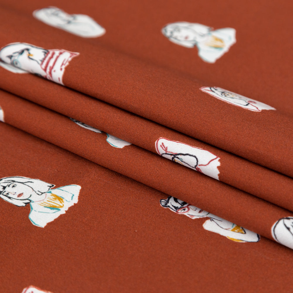 Stretch Cotton Sateen - Rust Faces - Run the World Print - Mood Exclusive Harvest Collection - Folded