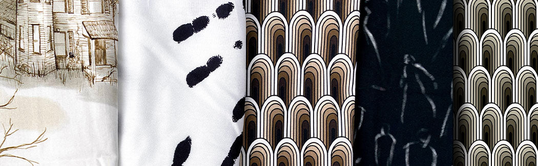Image of a variety of fabrics with a tree in the background