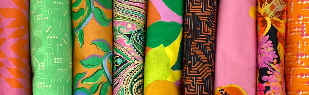 A close up of a bunch of different colored fabrics