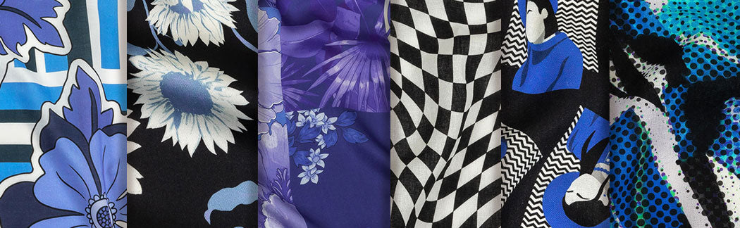 A close up of a bunch of ties with different designs