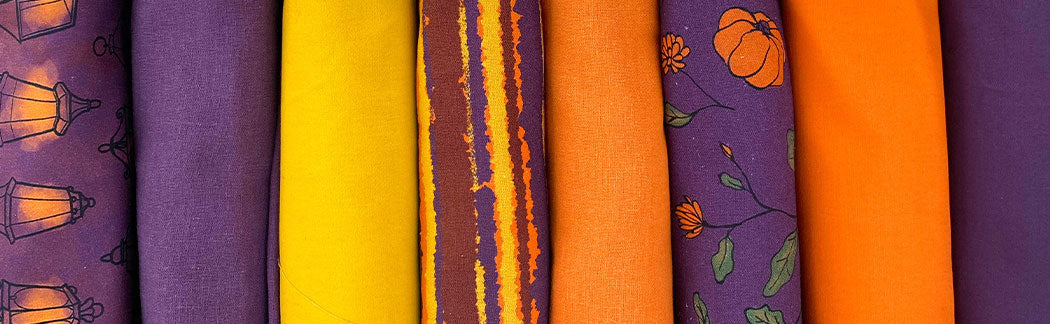A close up of a bunch of different colored ties