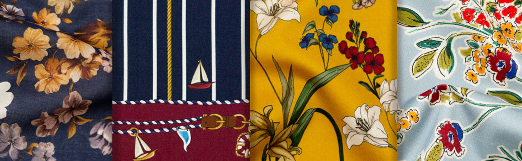 A close up of a bunch of ties with different designs