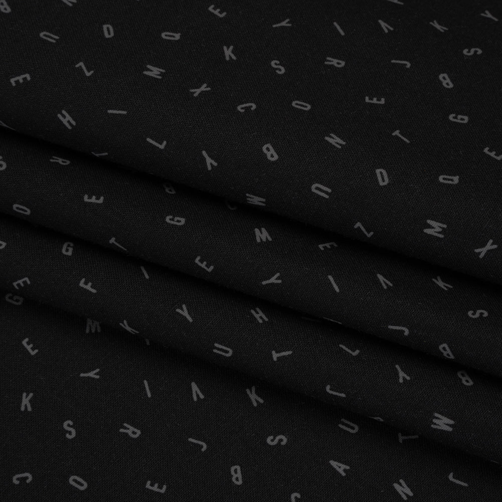 Printed Quilting Cotton by Ghazal Razavi for FIGO Studio - Black and Gray Jumbled Letters - Dusk Collection - Folded