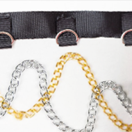 A close up of a belt with chains and a chain