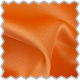 A close up of a orange fabric with a scallop edge
