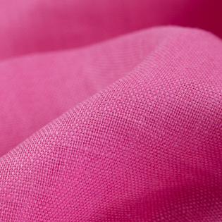 A close up of a pink fabric with a very thin pattern