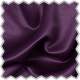 A close up of a purple fabric with a scallop edge