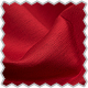 A close up of a red cloth with a scallop edge